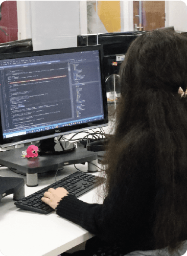 Inspiretec female developer working on a computer