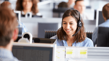 Happy woman in a call centre
