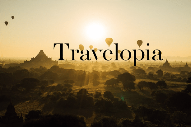Travelopia logo on a landscape background