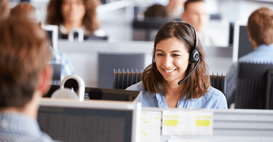 Happy woman in a call centre