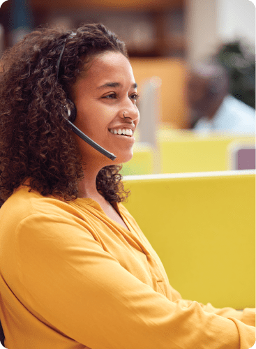 Inspiretec_travel_CRM_rectangle_1 Happy woman working in a call centre.